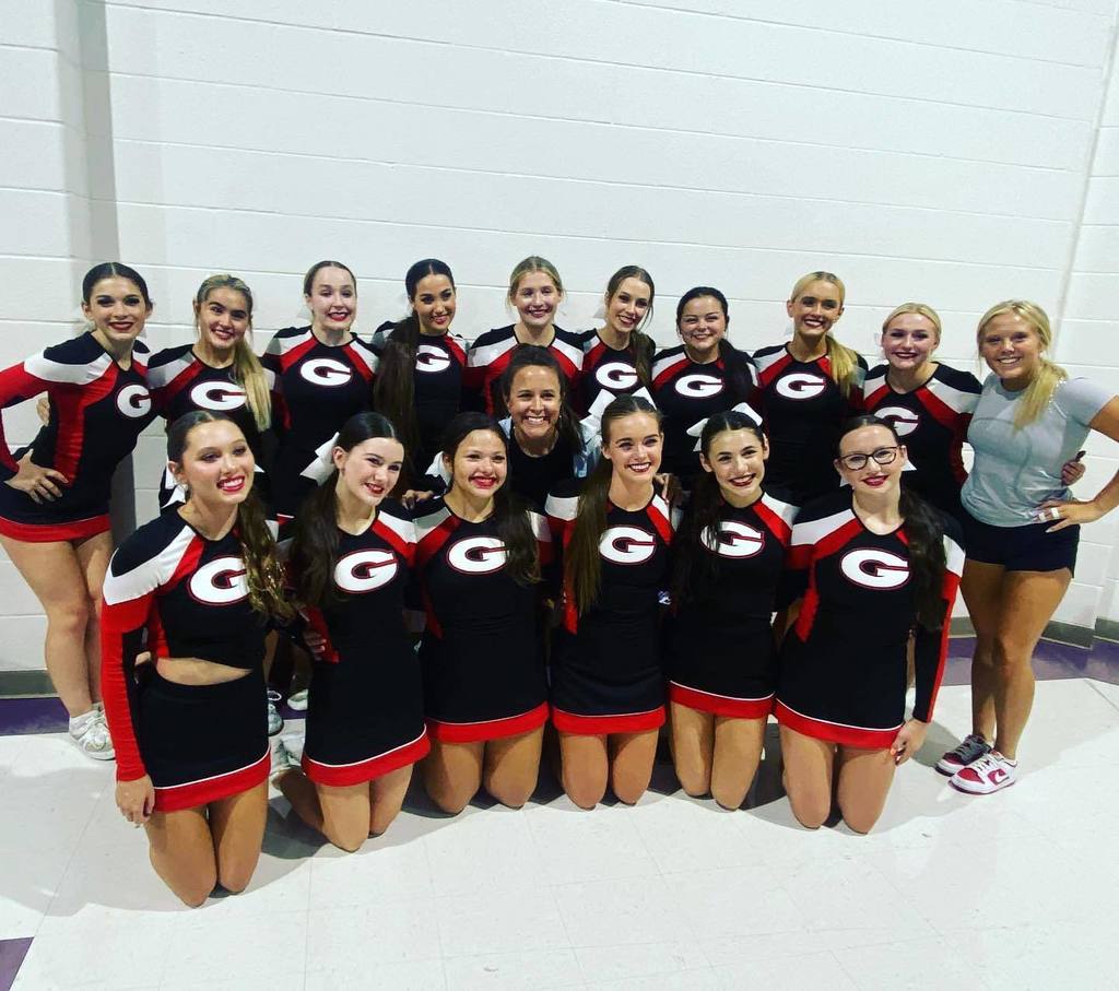 Grove HS cheer squad in black and red uniforms